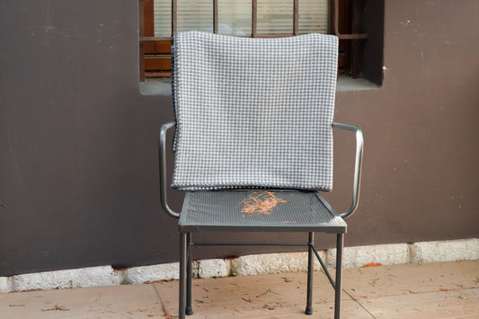 Coperta in fantasia pied de poule con bordatura